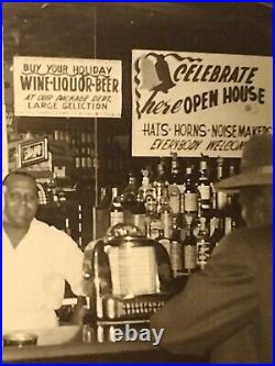 African American Liquor store owner Beer signs price on wallLouisiana