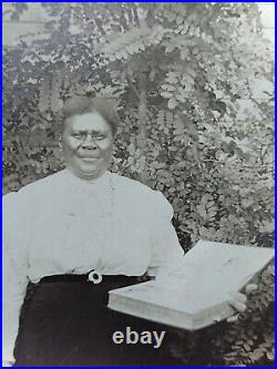 African American female holding a Bible Dress for Church