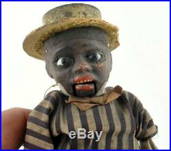 Antique Early Black Paper Mache Doll Americana Glass eyes push belly mouth moves