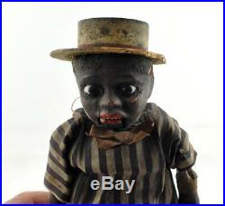 Antique Early Black Paper Mache Doll Americana Glass eyes push belly mouth moves