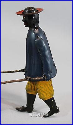 Antique Strauss Tip Top Key Wind Tin Toy, Black Man Porter, NR