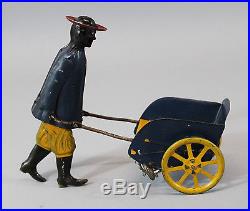 Antique Strauss Tip Top Key Wind Tin Toy, Black Man Porter, NR