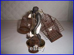BLACKAMOOR AMERICAN COLD PAINTED METAL FIGURE WITH CAGES OF BIRDSPETITE CHOSES