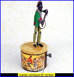Banjo dancer Black Americana tin wind-up jigger toy. SEE MOVIE