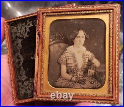 Beautiful sixth plate daguerreotype of a young woman in fancy dress and chair