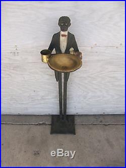 Black americana cast iron and brass ash tray-butler
