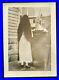 Creepy unusual old snapshot photo long black hair girl turned away from camera