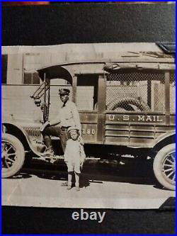 Extremely Rare African American male Mailman standing beside his truck #1