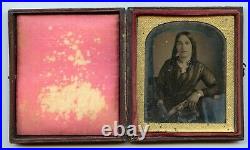 Sixth plate daguerreotype of a young lady with a great dress and curls