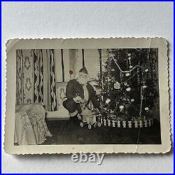 Vintage 1950s B&W Snapshot Photograph Santa Claus Gifts Doll Odd Christmas