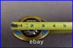 Zuni belt buckle, inlay work with turquoise, mother of pearl, and onyx